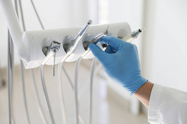 Professional Tooth Extraction technician working in Bellevue, MI